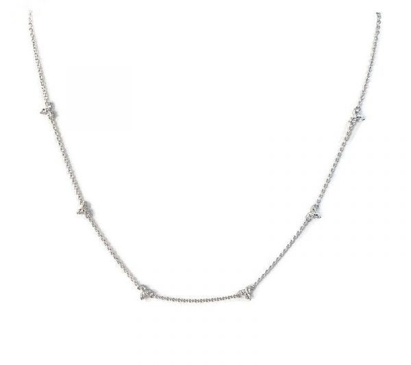elegant piece features dainty diamond trios strung along a delicate Silver with 14K gold plated cable chain.